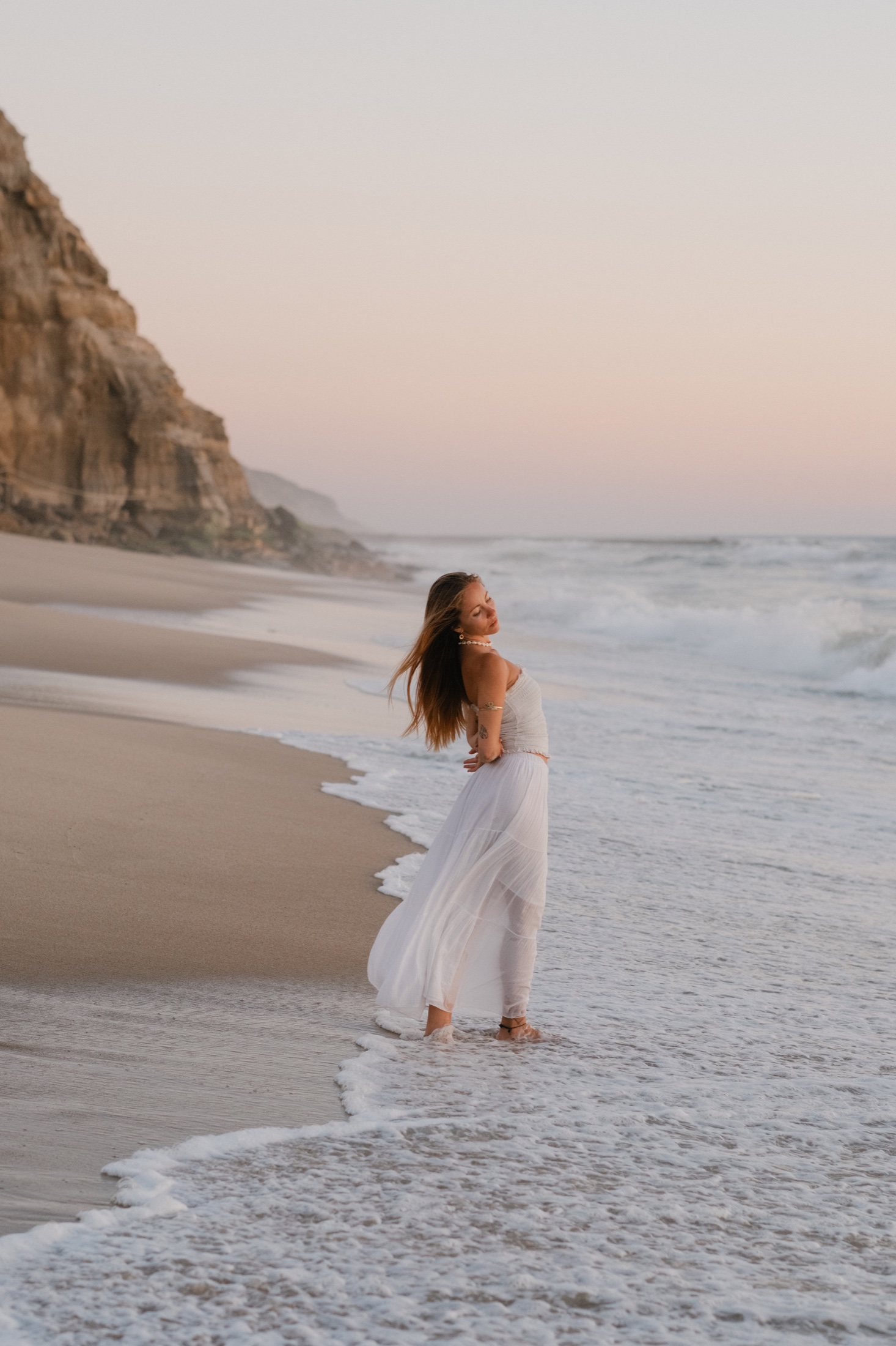 Amelia photographed at dusk on São Julião beach