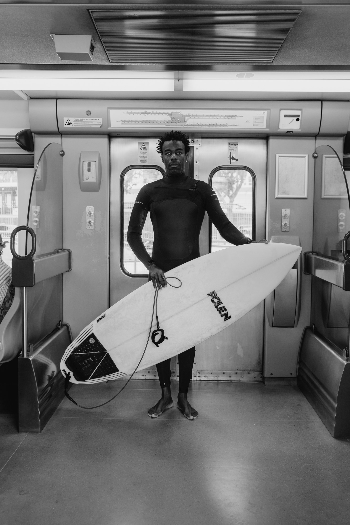 Surfer travelling with his board