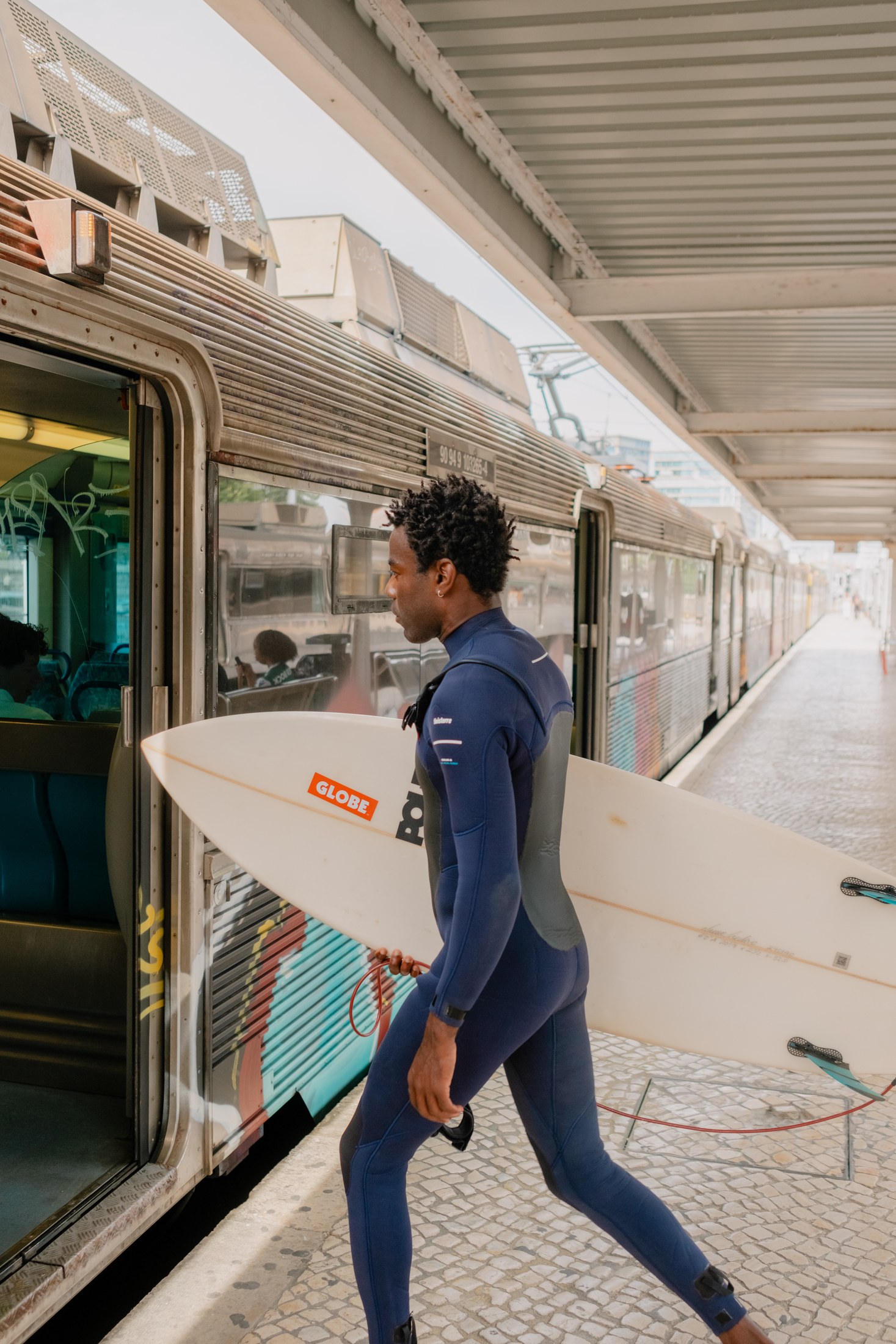 Surfer arriving at the train