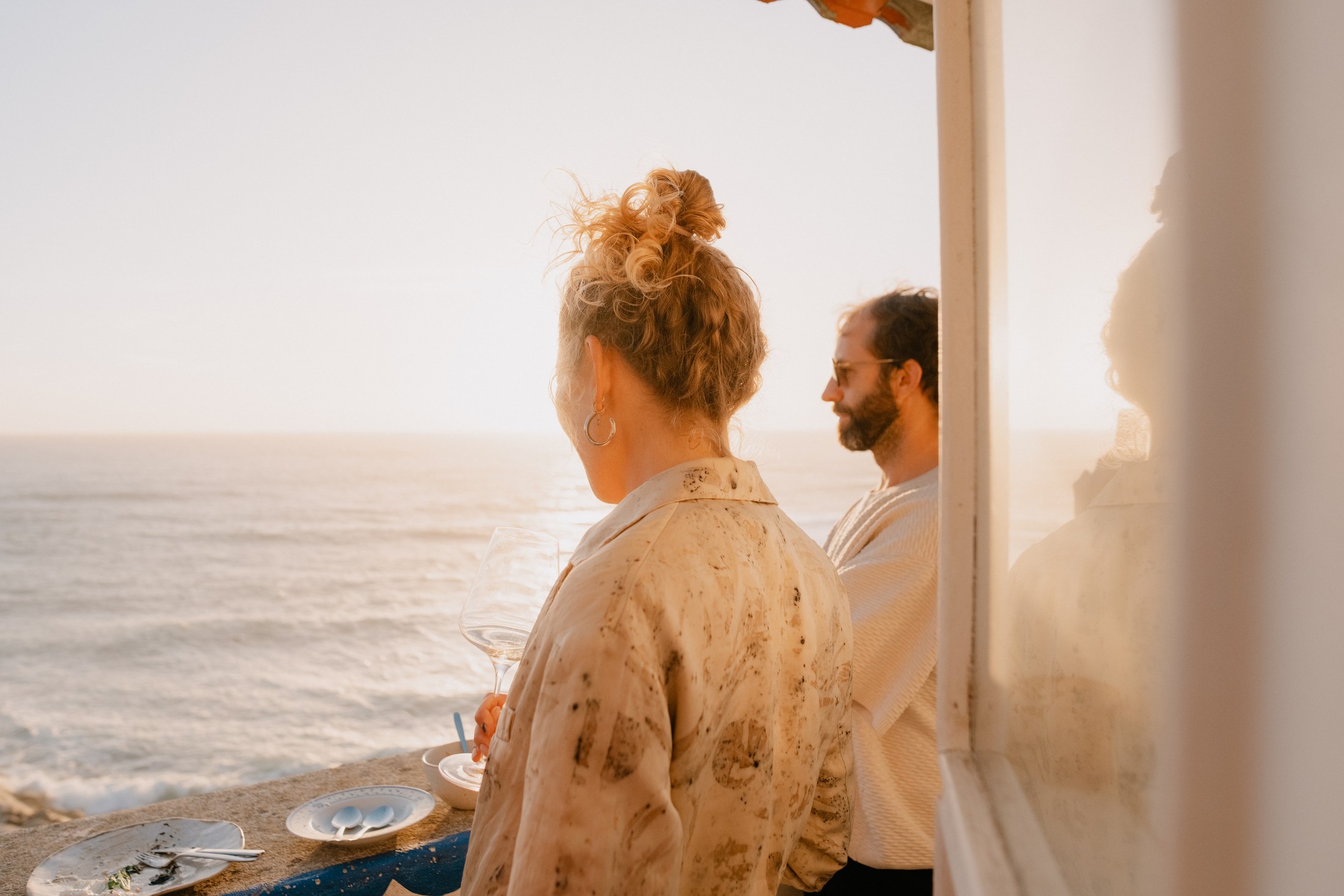 Guests talking beside the ocean