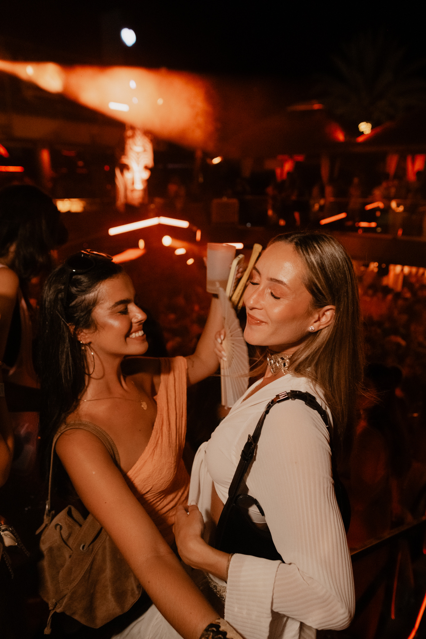 Two friends dancing in the crowd