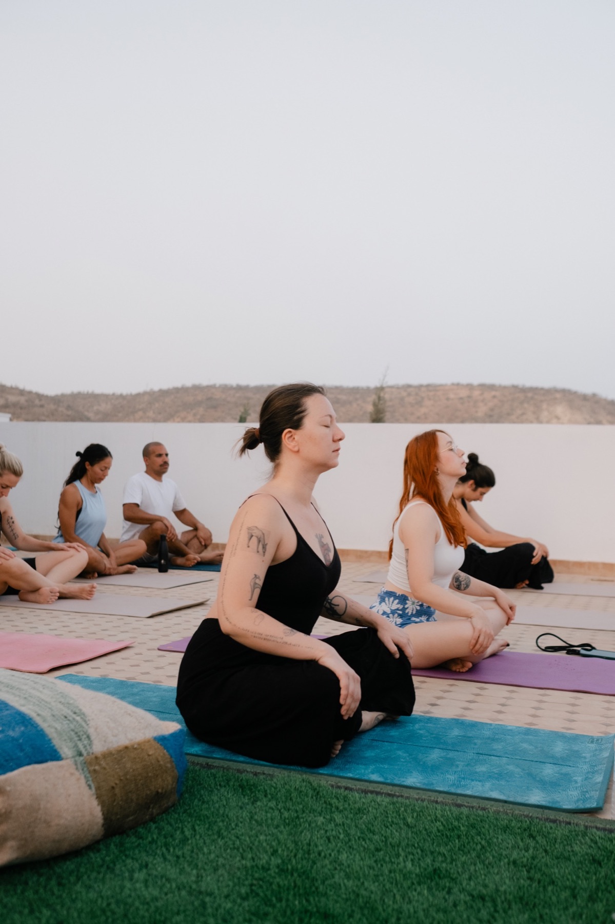 Yoga beside the pool at Surf Villa Morocco