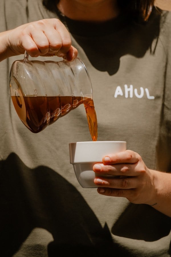 Coffee being poured in warm sunlight