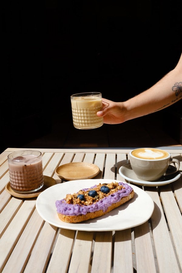 Drinks and breakfast arranged in sunlight