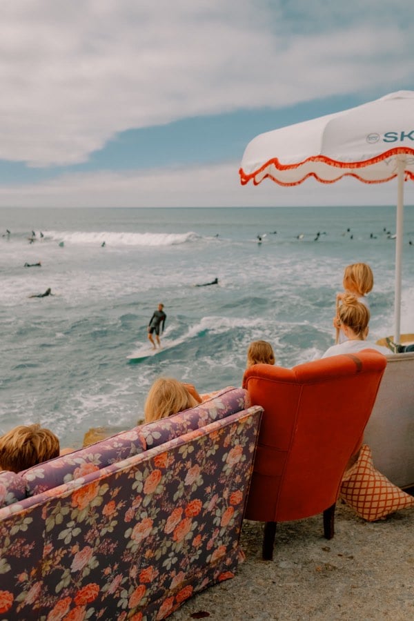Colorful sofas overlooking a surf break