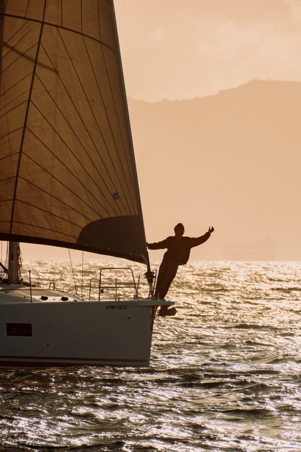 Sailboat silhouette in golden light