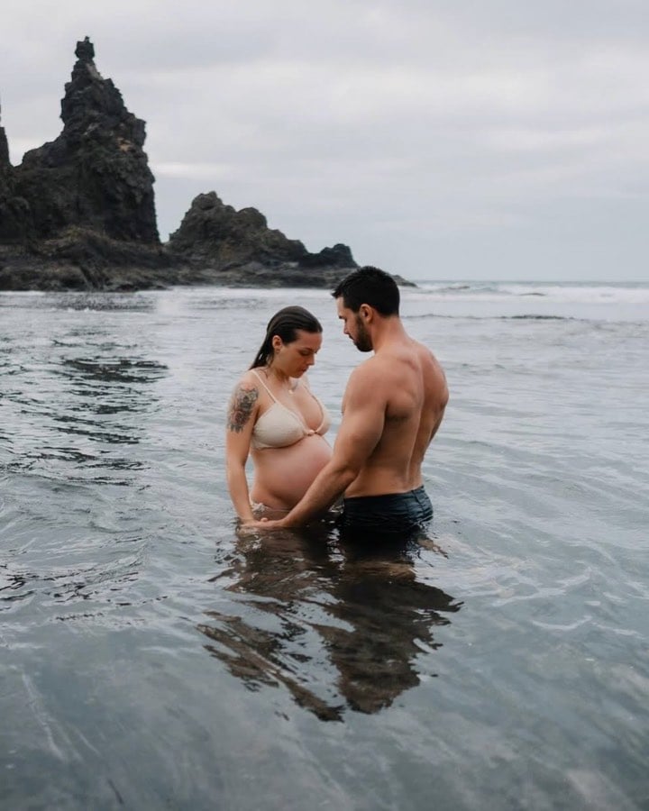 Couple standing together in the sea