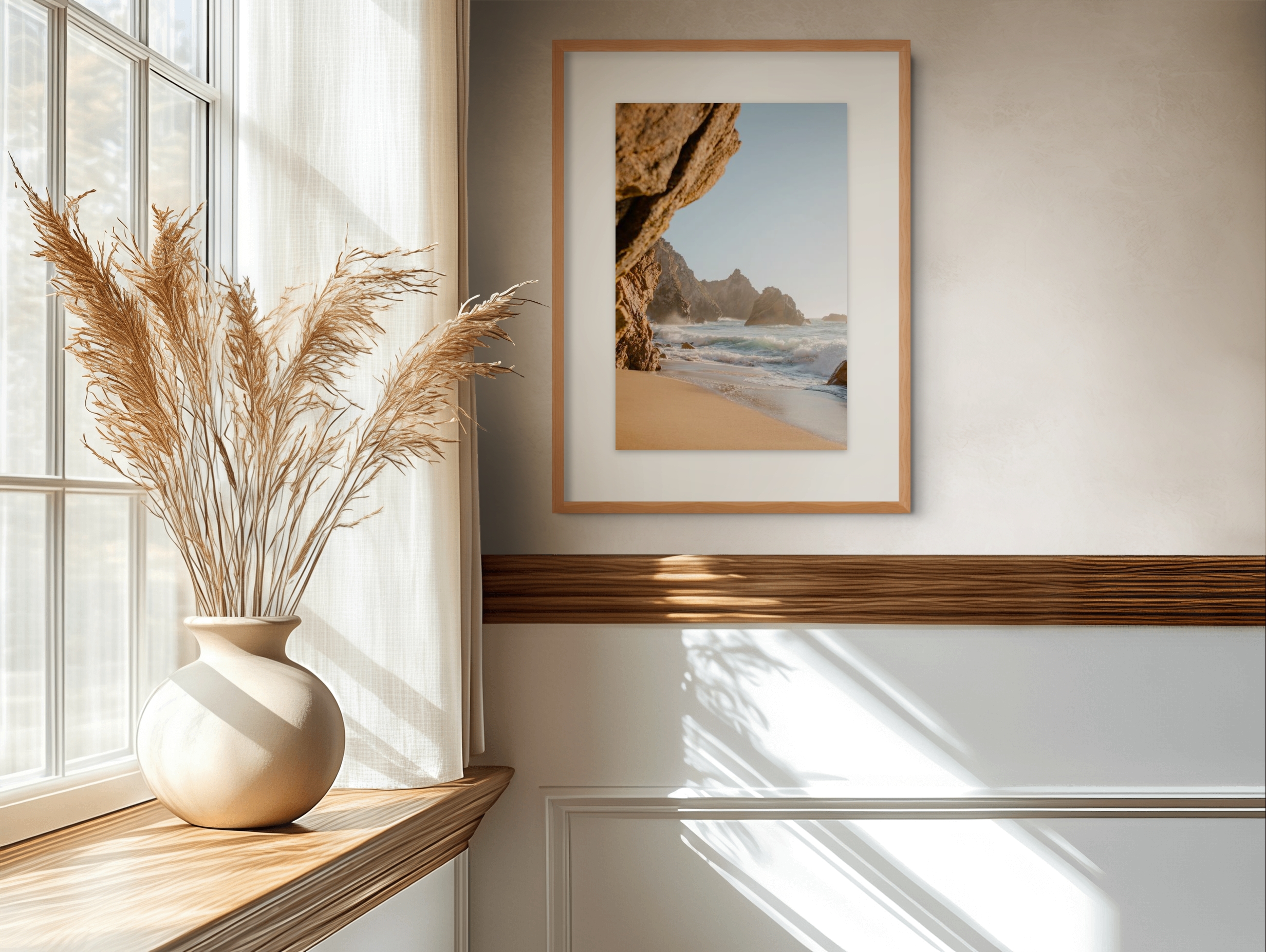 Coastal print displayed beside a bright window