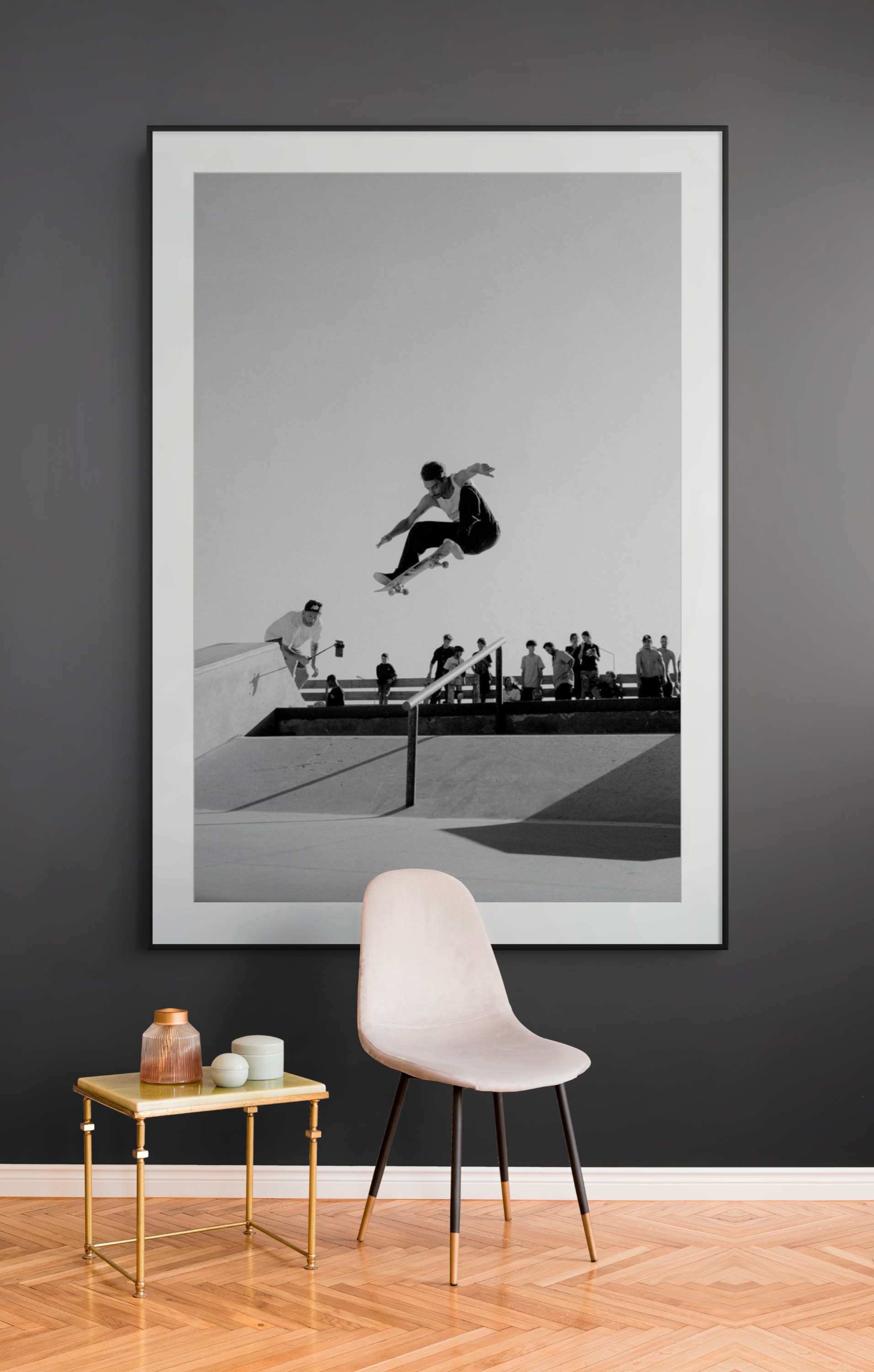 Black and white skateboarding print displayed in a dark interior