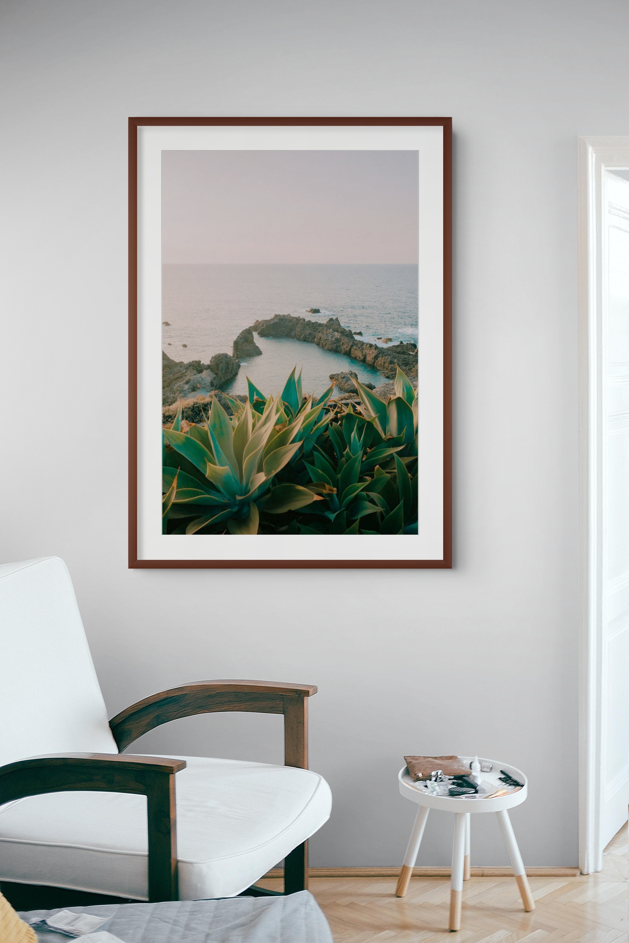 Atlantic landscape print displayed in a bright sitting room